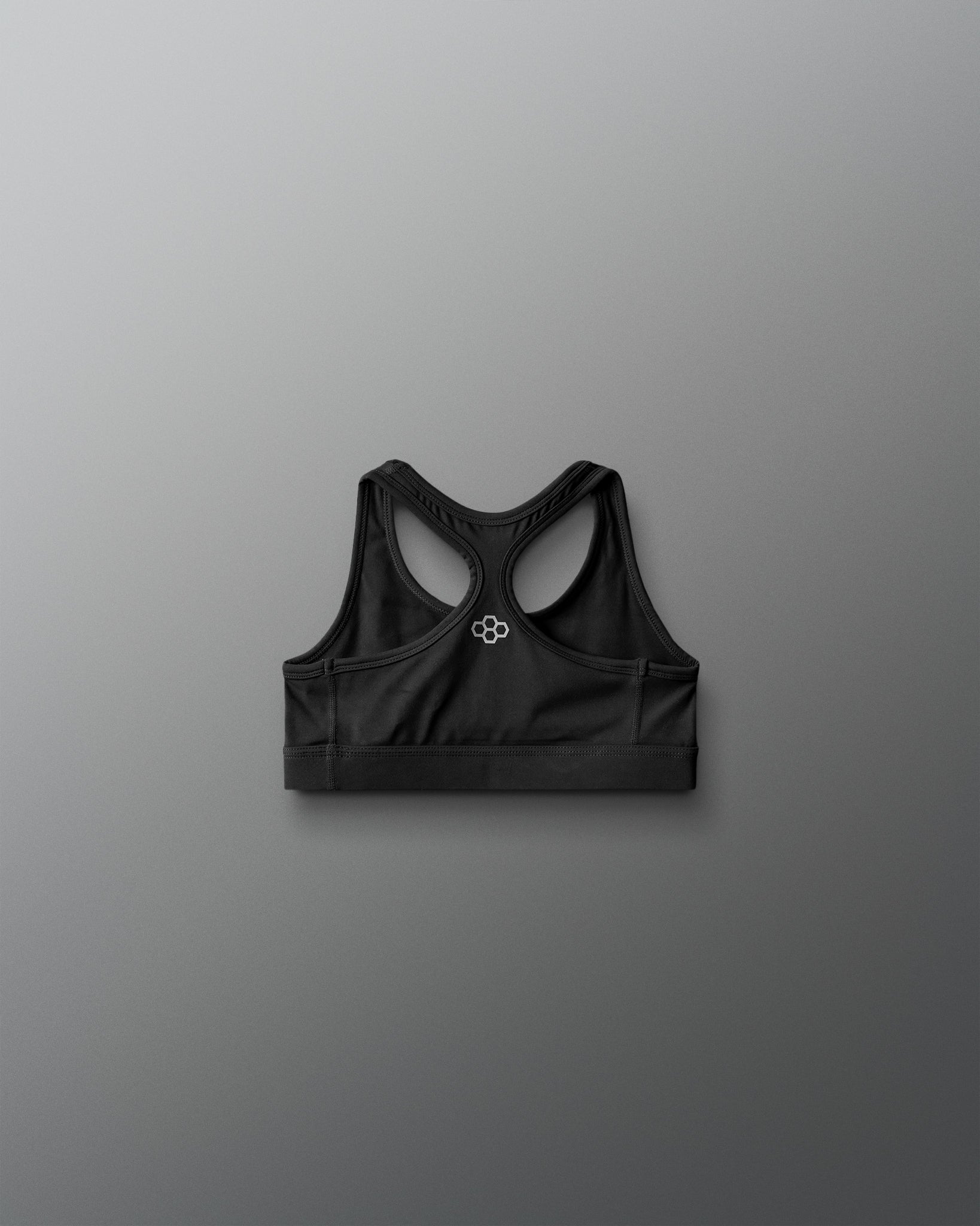 Black sports bra on a gray background