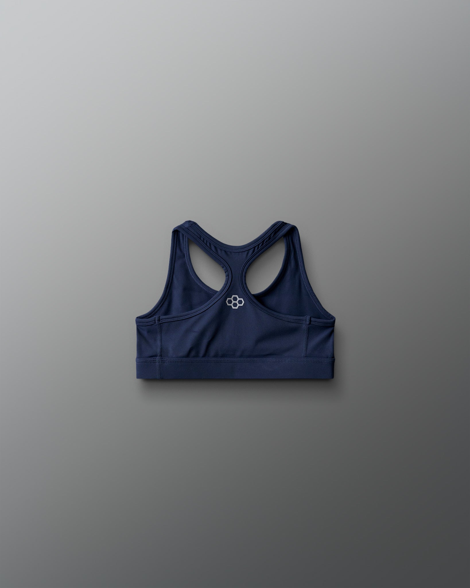 Navy blue sports bra on a gray background