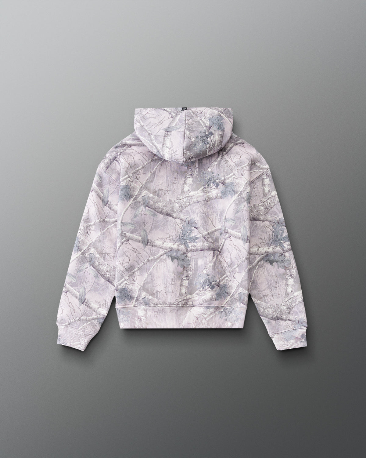RUDIS Essential Hex Youth Relaxed Comfort Fleece Hoodie in Tree Camo, back view showing the allover tree camouflage pattern, hood, and ribbed cuffs. Copy Alt Text