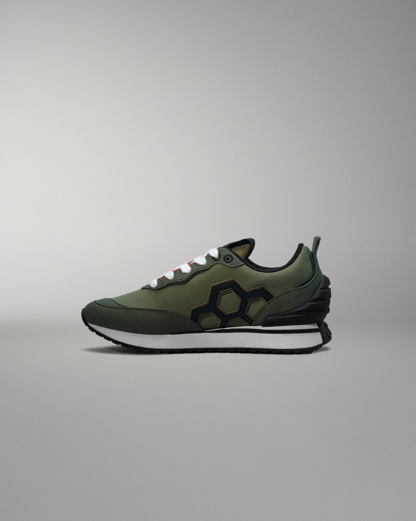Green sneaker on a gray background
