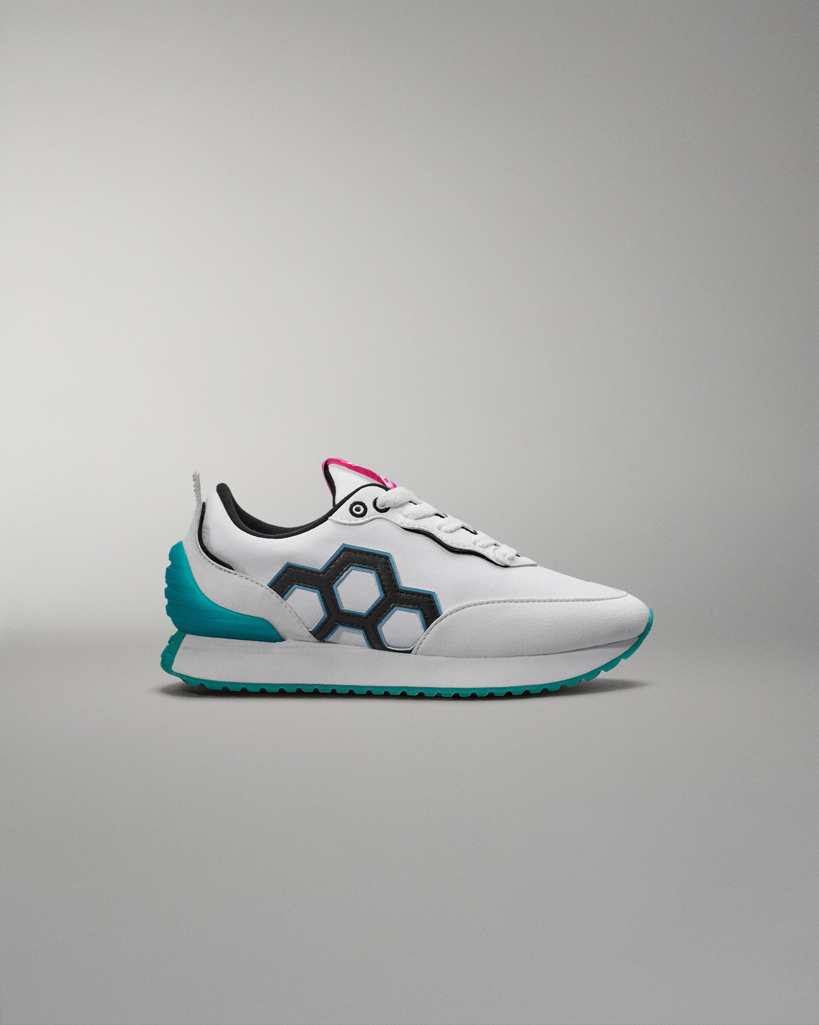 White sneaker with blue accents on a gray background