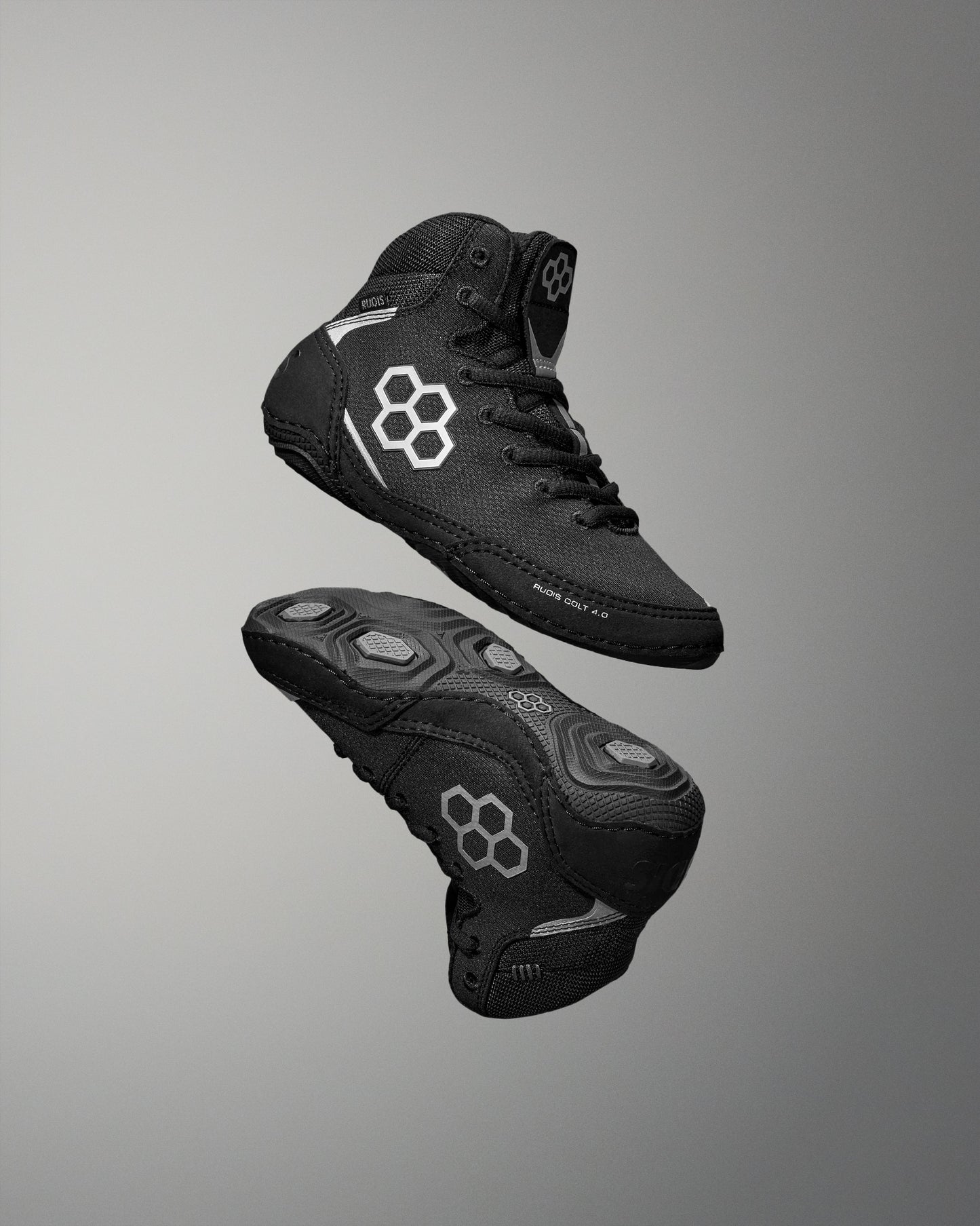 Black Wrestling Shoes with brand logo on a gray background