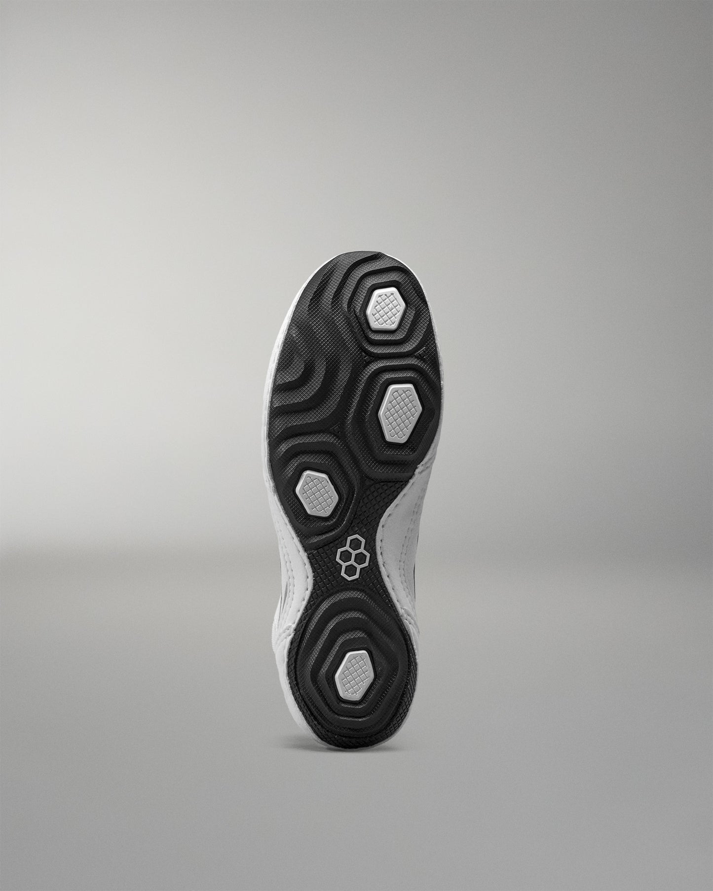 Close-up of a Wrestling Shoe sole with a brand logo on a gray background
