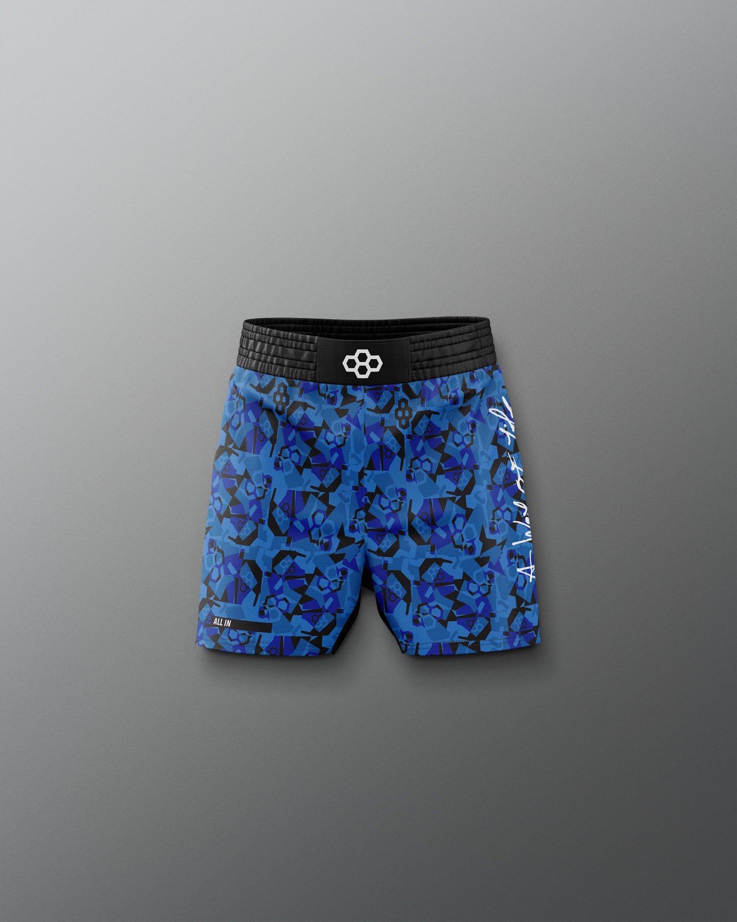 Blue patterned wrestling shorts with a black waistband on a gray background