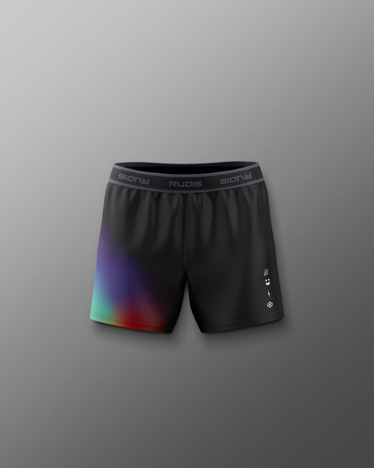 Black athletic shorts with colorful gradient design on a gray background