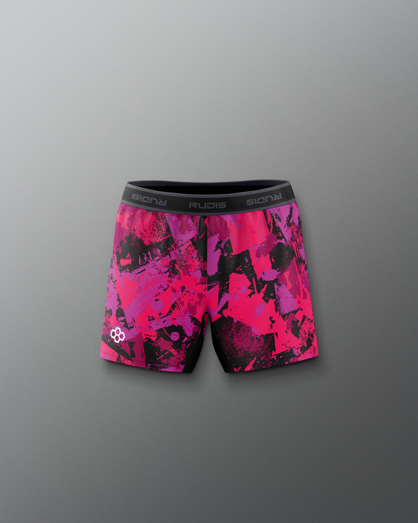 Pink and black patterned shorts on a gray background