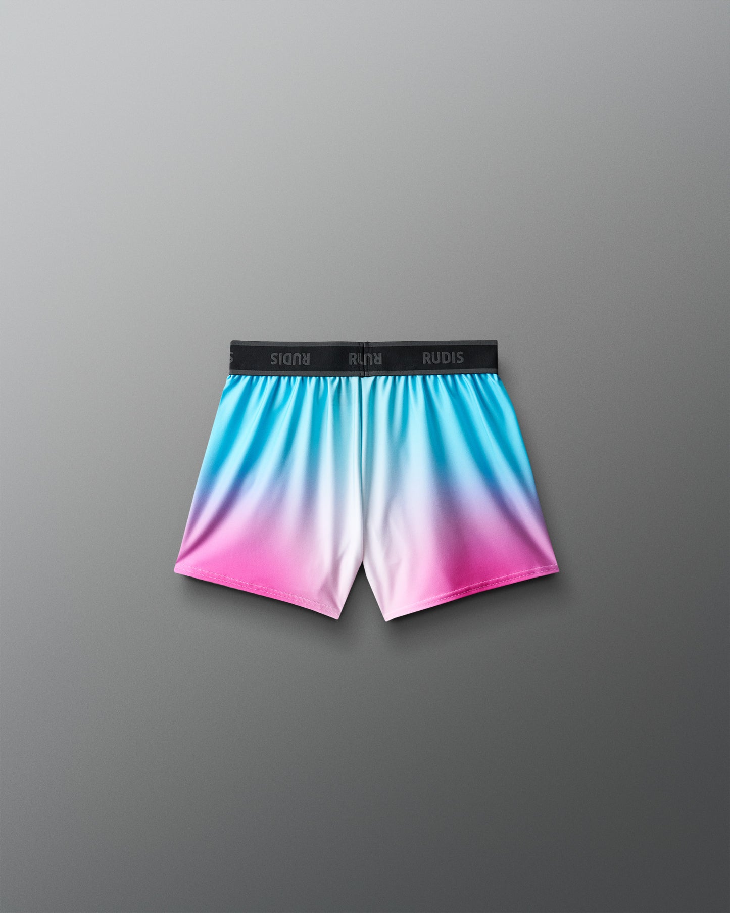 Gradient shorts with blue, pink, and white color on a gray background