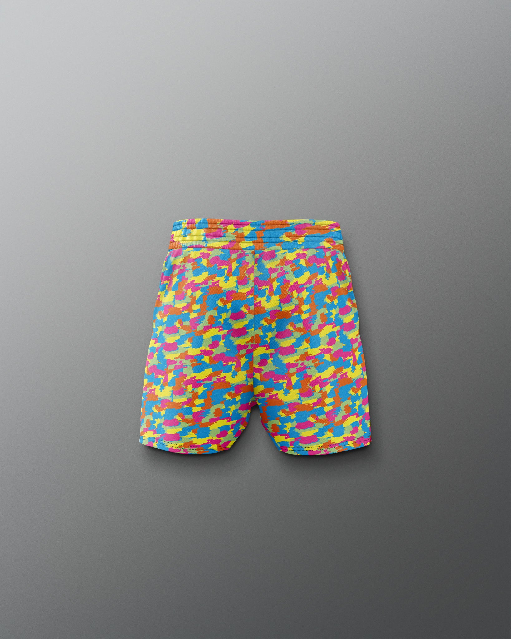 Colorful camouflage-patterned shorts on a gray background