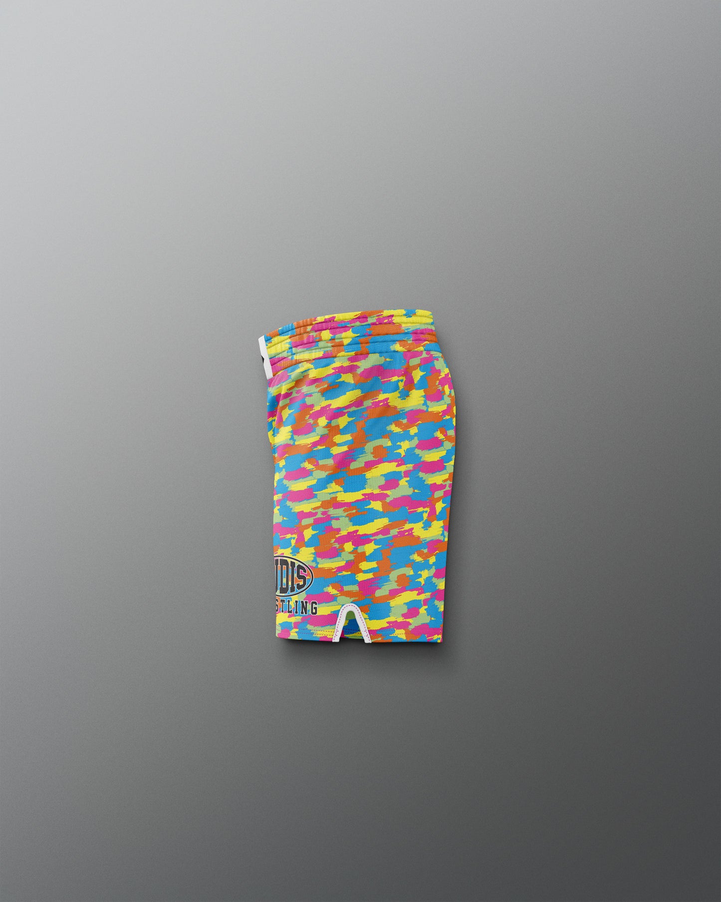Colorful camouflage-patterned shorts on a gray background