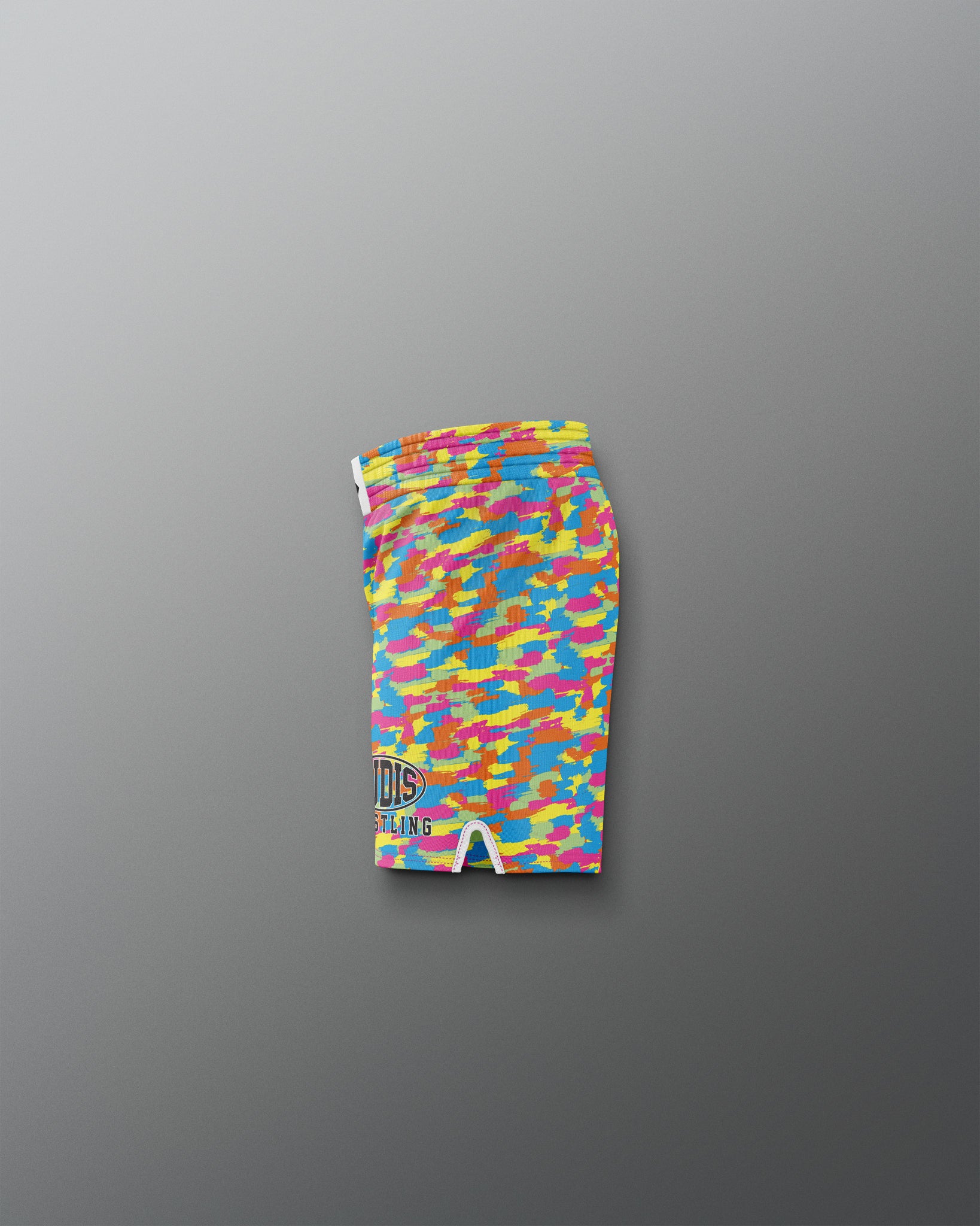 Colorful camouflage-patterned shorts on a gray background