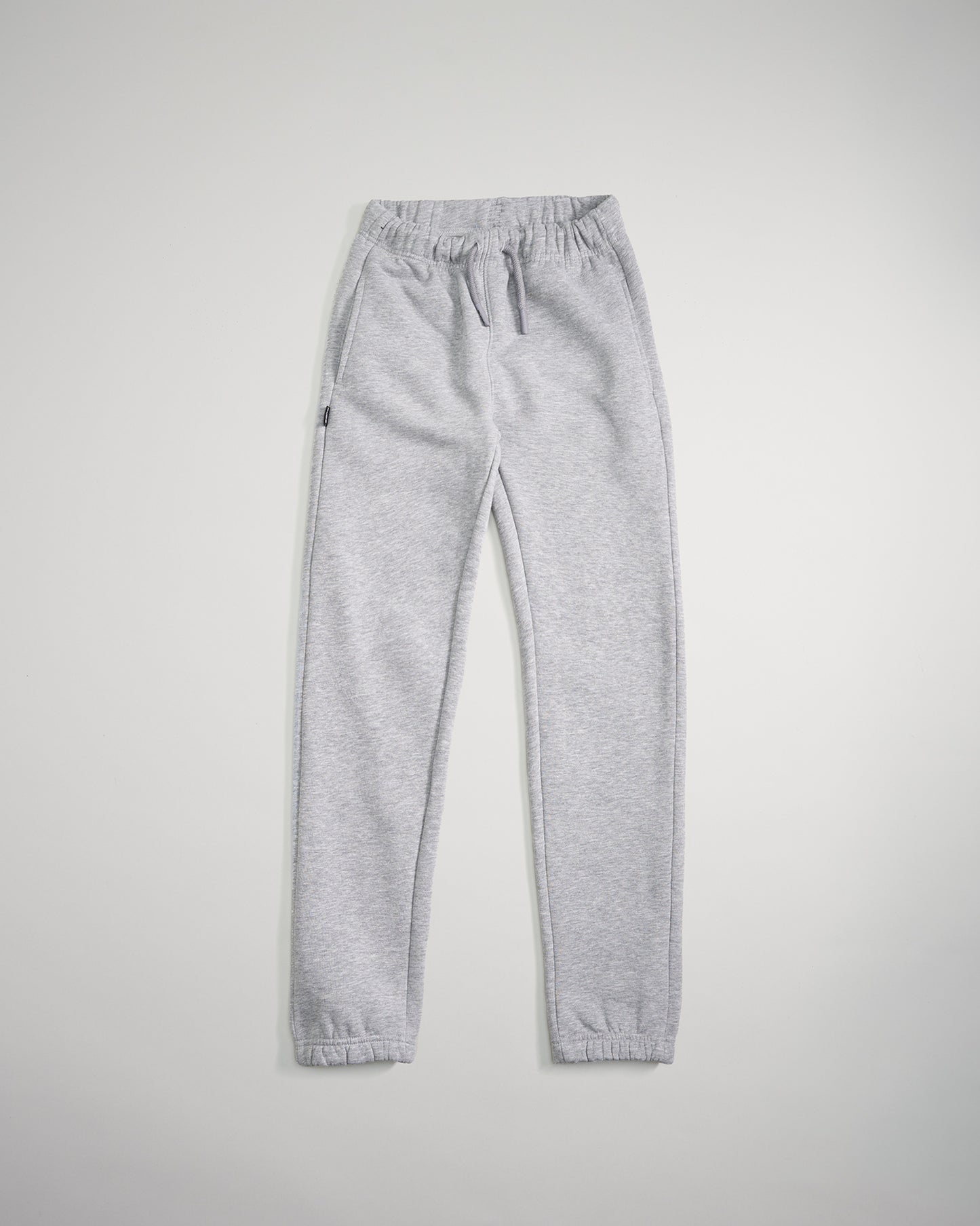 A pair of light gray sweatpants featuring an elastic waistband and tapered ankles designed for comfort and casual wear