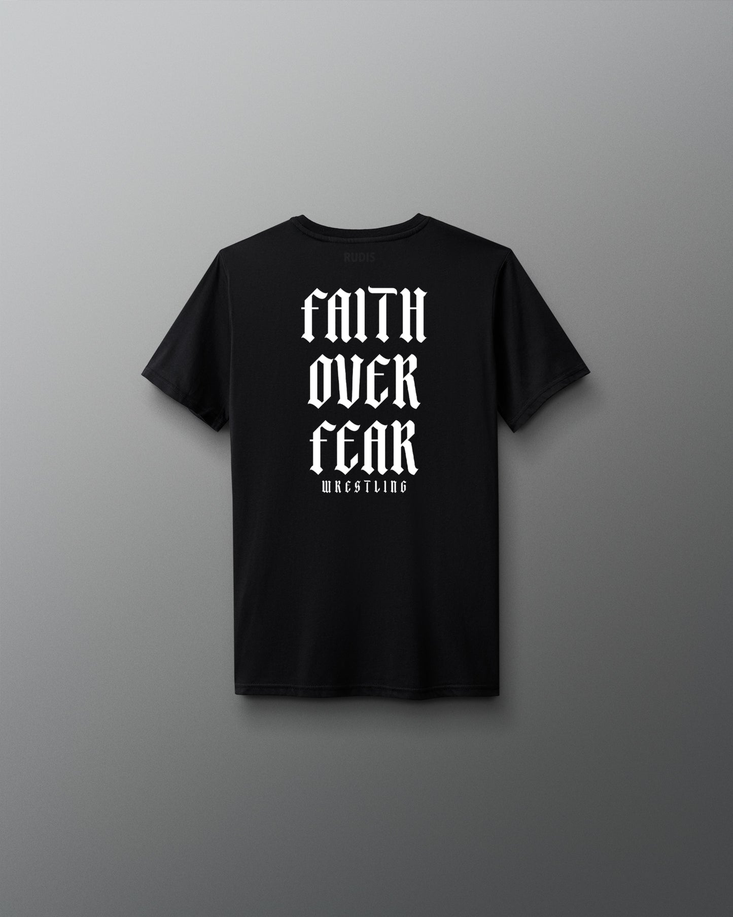 Back view of a black T-shirt featuring bold white gothic-style text that reads ‘Faith Over Fear Wrestling’ stacked vertically.
