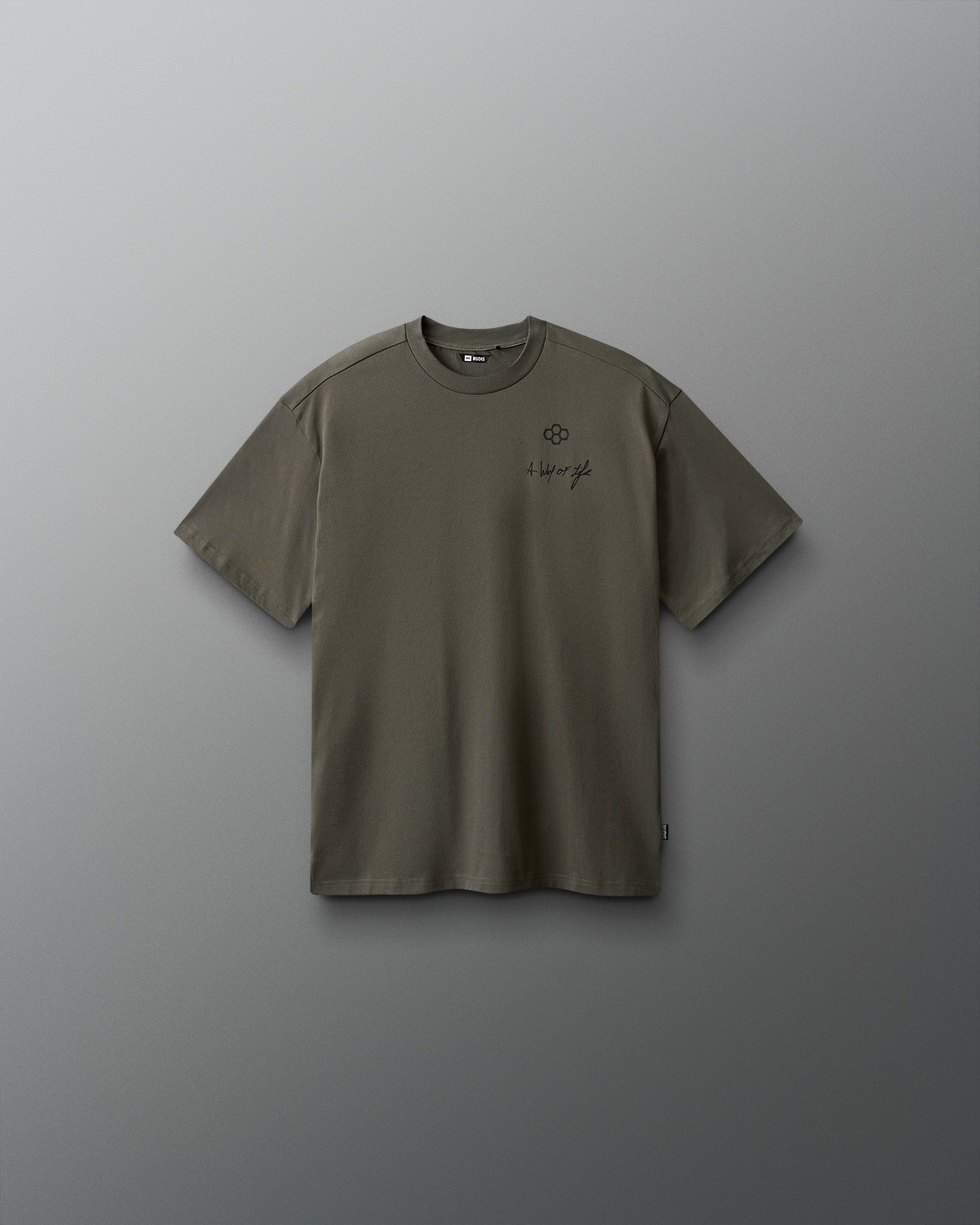 Green t-shirt with a small logo on a gray background