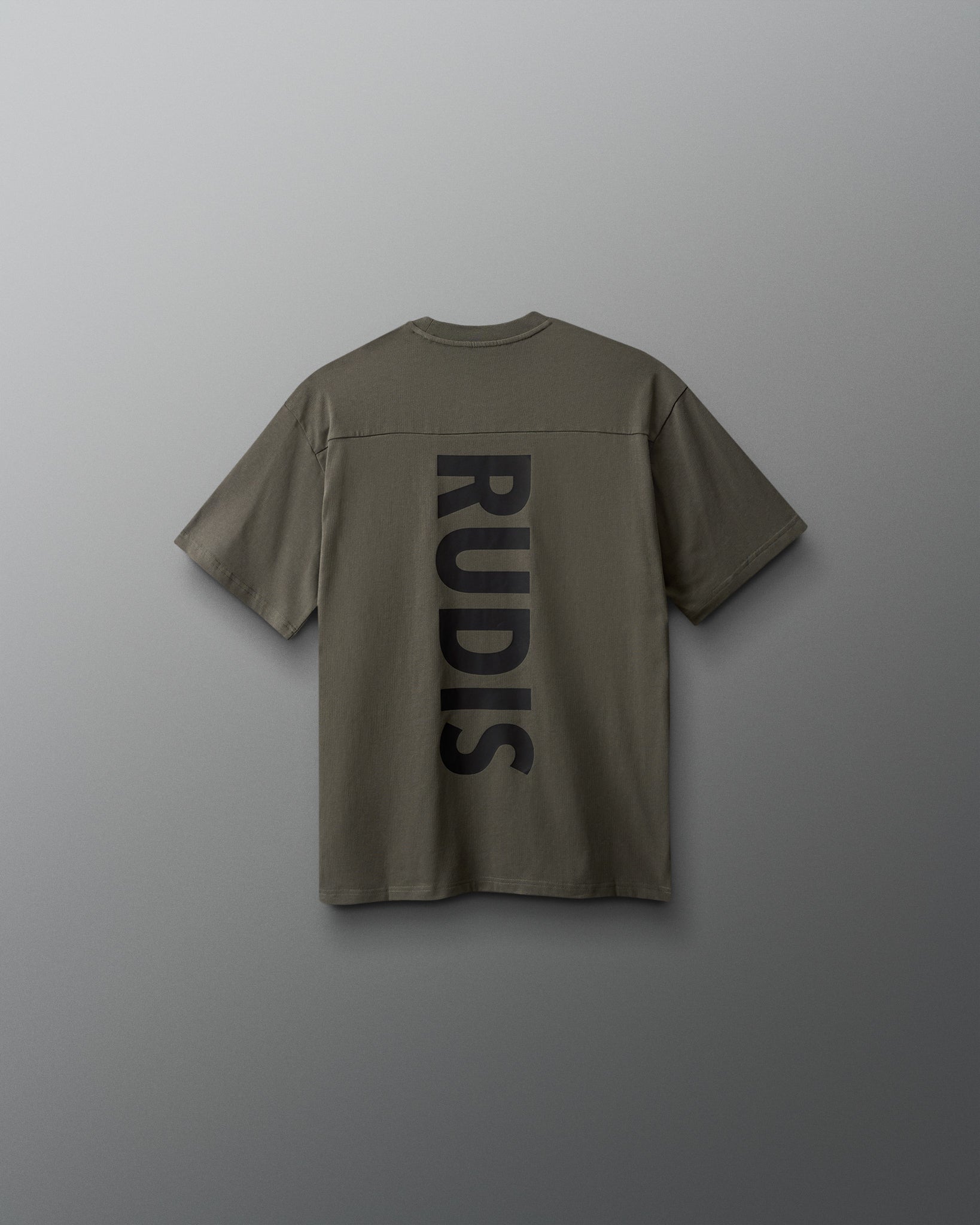 Green shirt with 'RUDIS' branding on the back against a gray background