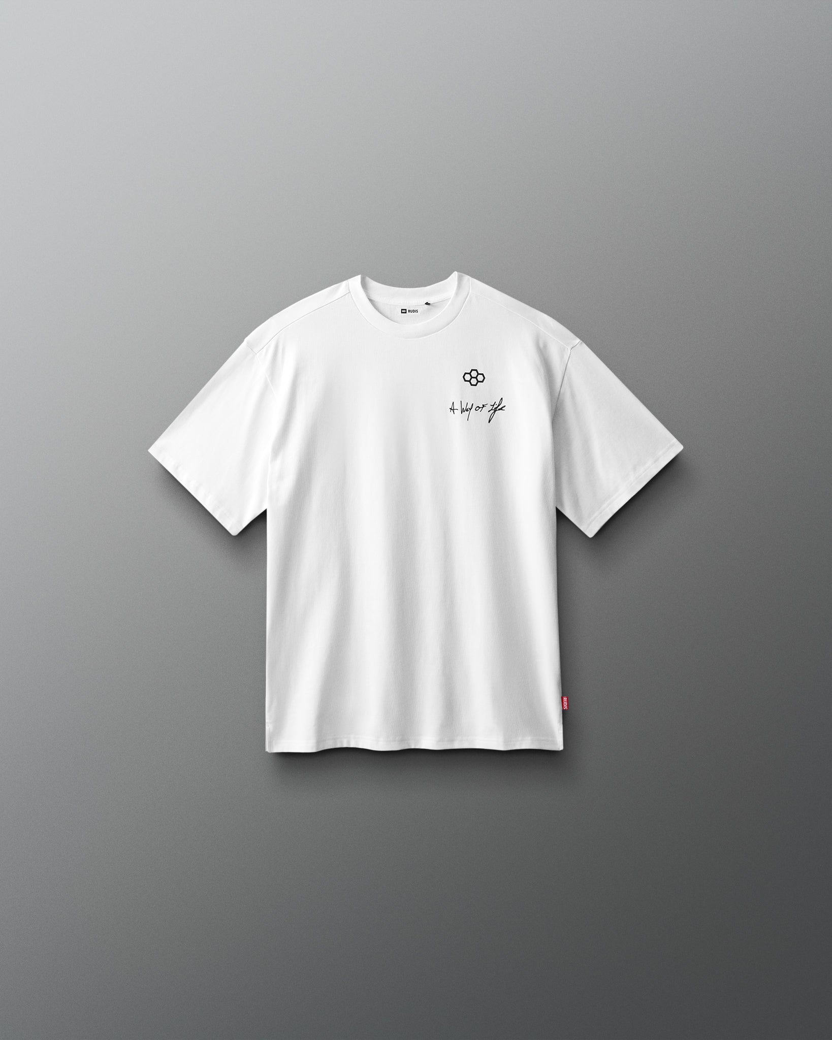 White t-shirt with a small logo on a gray background