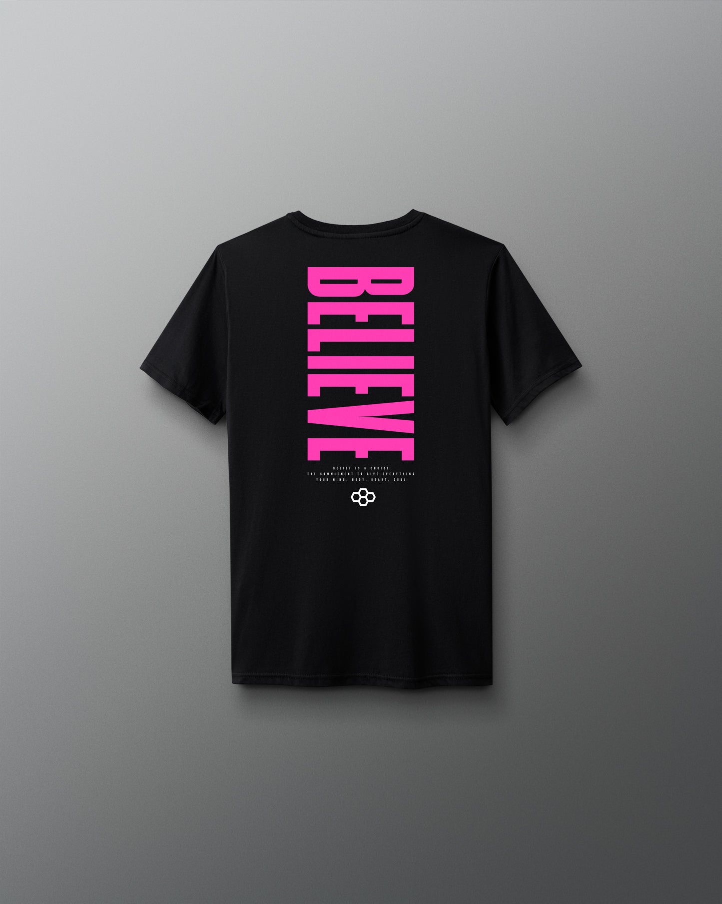 Black t-shirt with pink 'BELIEVE' text on a gray background