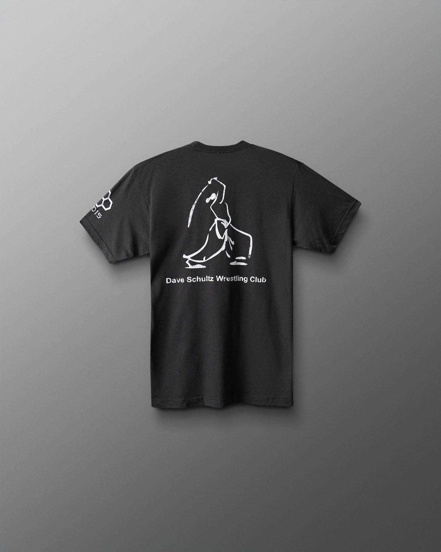 Black t-shirt with white graphic and text on a gray background