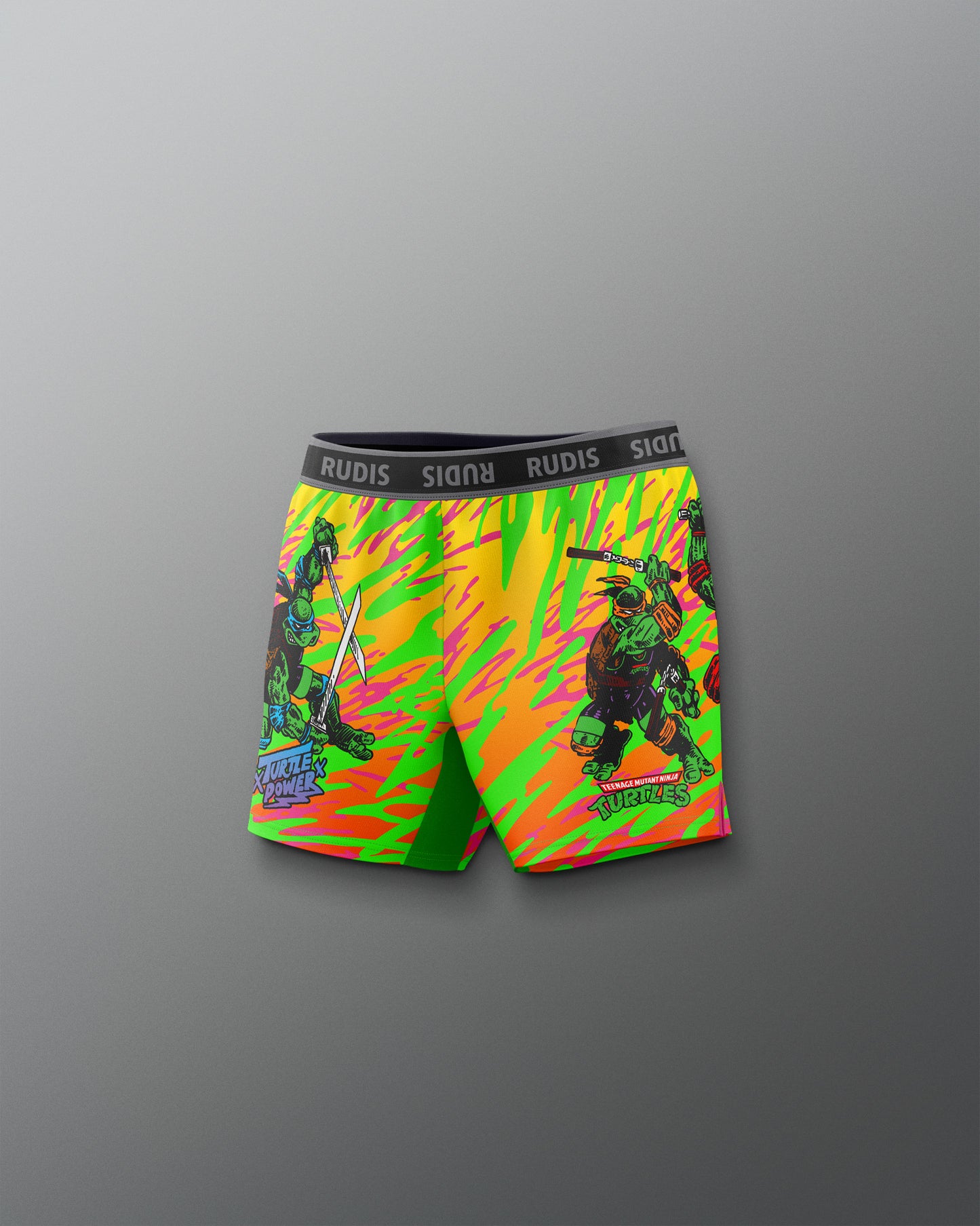 Colorful graphic shorts with a brand logo on a gray background