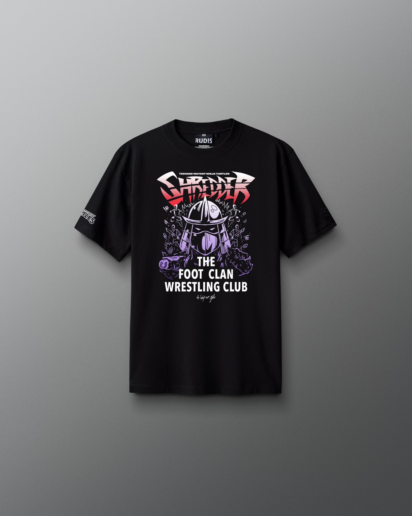 Black t-shirt with wrestling graphic teenage mutant ninja turtle shredder and text on a gray background
