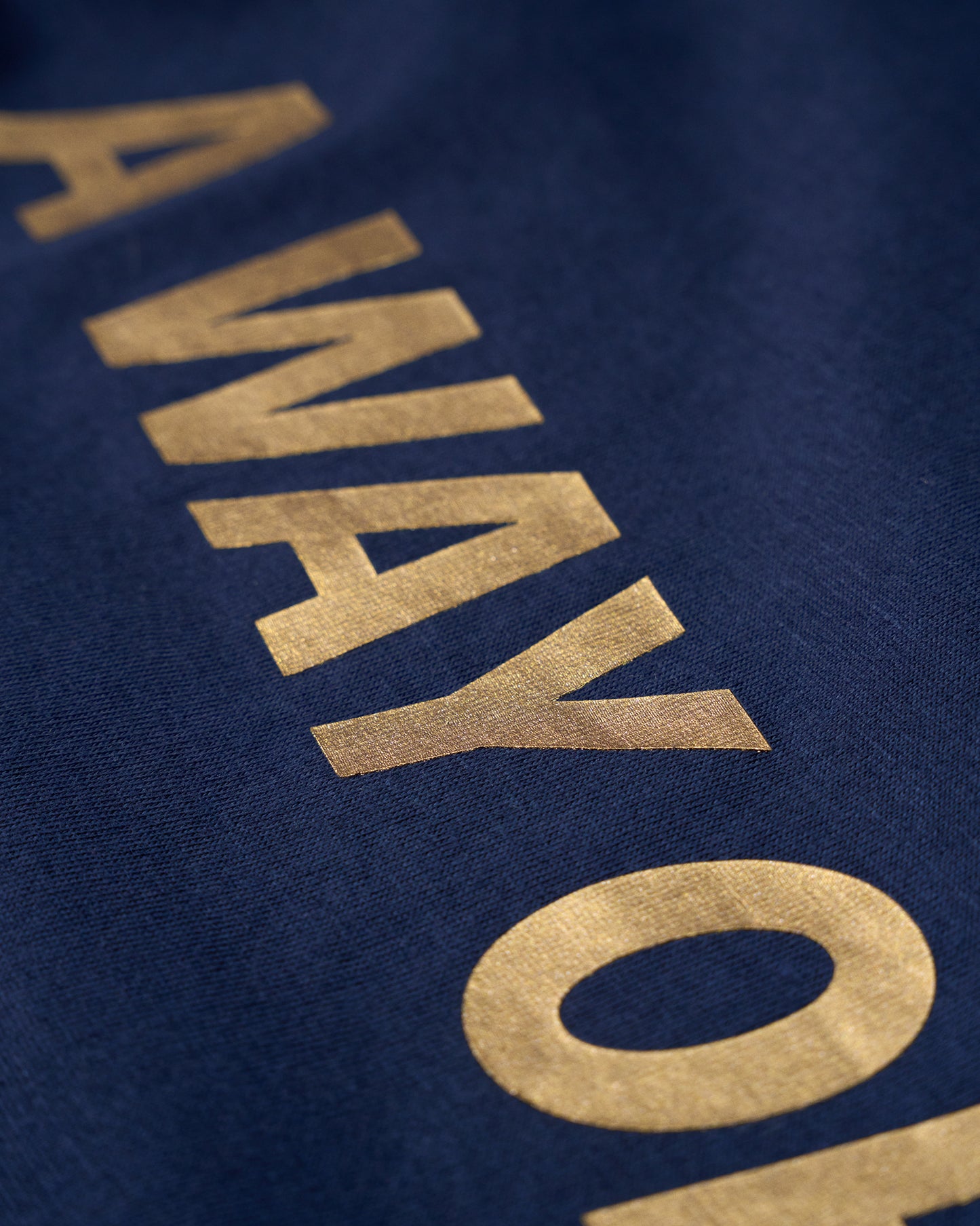 Gold 'AWAY' text on a blue background