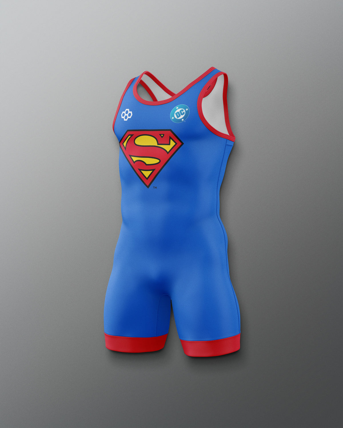 Angled view of RUDIS Superman Logo Youth Elite 2.0 Wrestling Singlet featuring a blue design, red trim and Superman shield graphic.