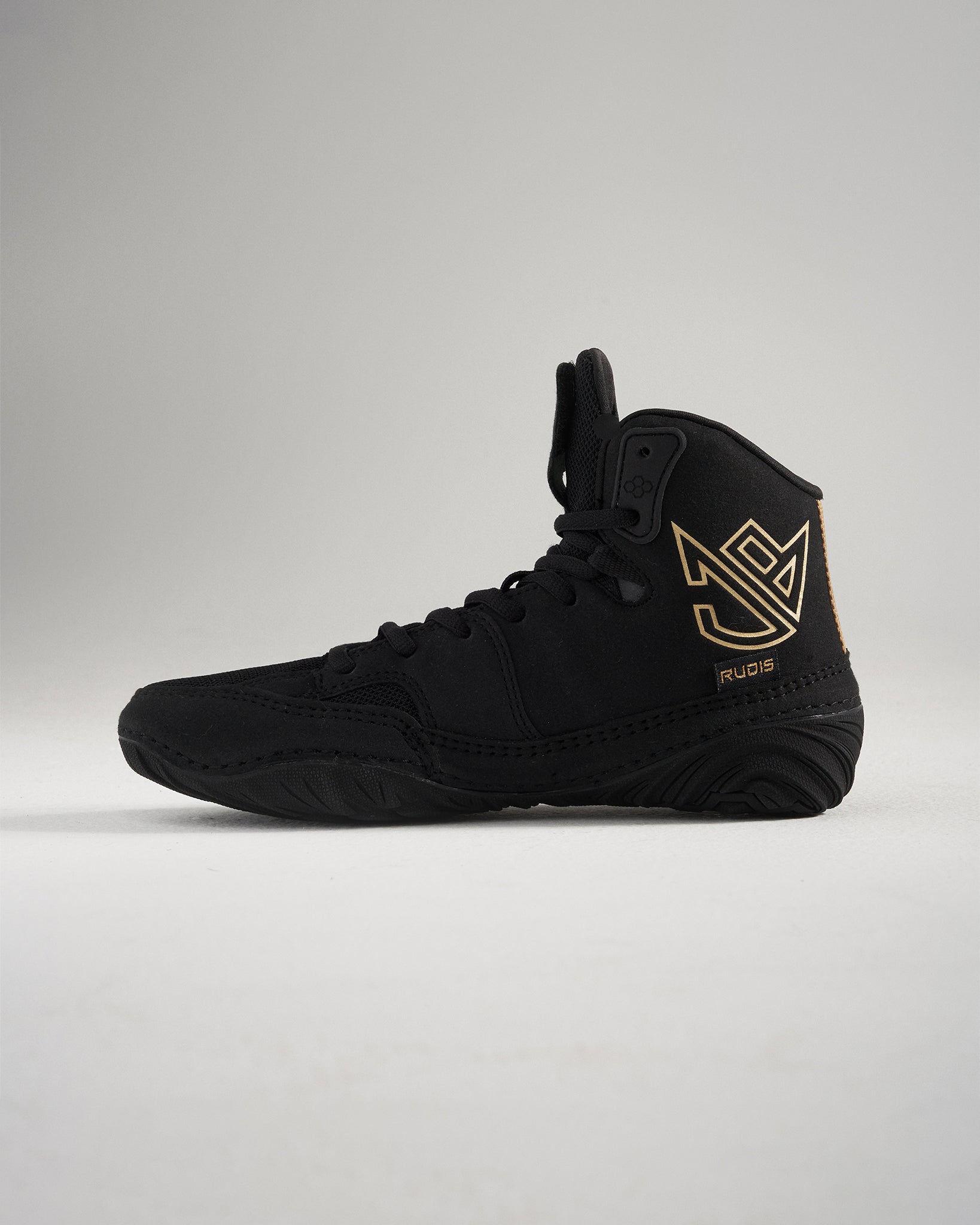 A stylish black wrestling shoe featuring a high-top design accented with a gold logo and branding for enhanced athletic performance