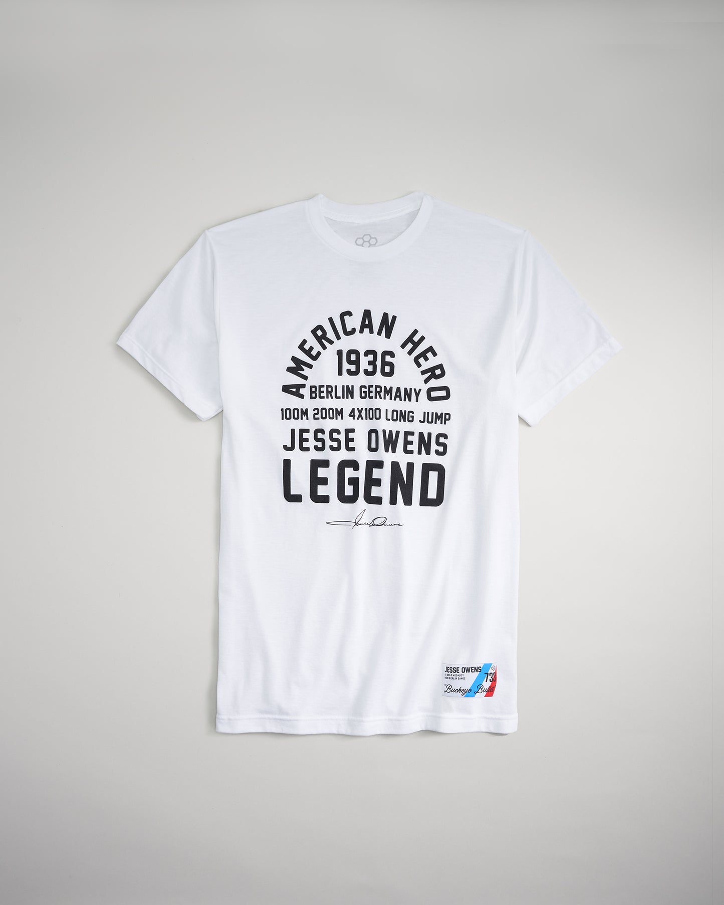 A white t-shirt featuring bold black text commemorating Jesse Owens and his legendary achievements at the 1936 Berlin Olympics