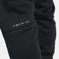 A close-up view of black sweatpants featuring the phrase A WAY OF LIFE printed in white on the thigh area