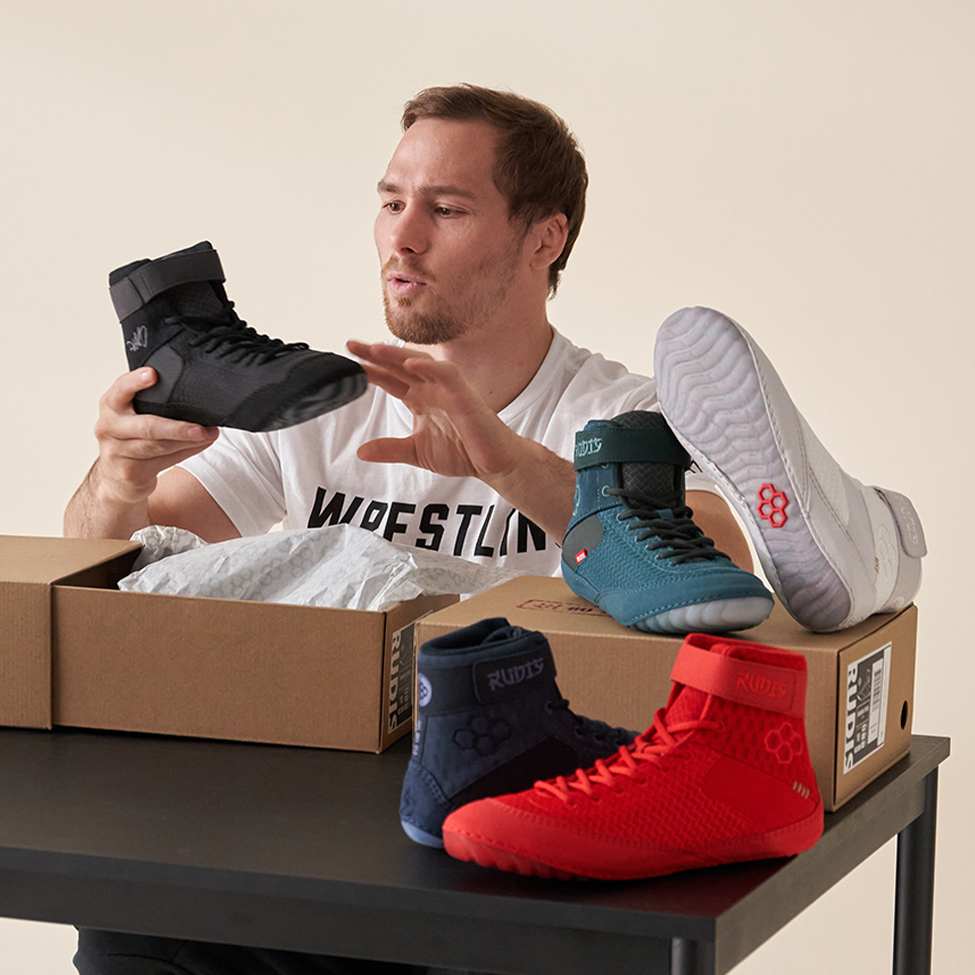 Spencer Lee unboxing RUDIS Samurai Speed wrestling shoes showcasing multiple colorways built for lightweight speed and performance