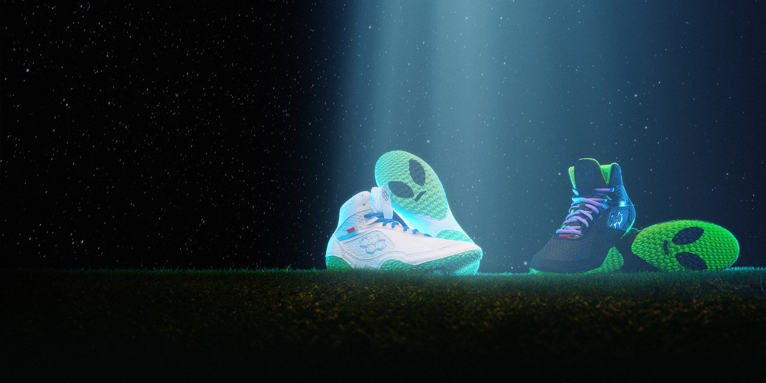 RUDIS Alpha 2.0 wrestling shoes in Alien and Martian colorways with glowing outsoles, highlighting grip, traction, and futuristic performance design