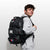 Image of Bo Bassett carrying the RUDIS Genesis Gearpack III - USA Wrestling Grey Camo