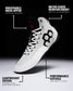 A high-top athletic wrestling shoe shown on a black-to-white gradient background with callout text and arrows explaining features: engineered mesh upper, micro-suede reinforcement, lightweight design, and performance outsole.
