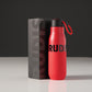 This image features a vibrant red water bottle with a black lid displaying the brand name RUDIS prominently on its body and accompanied by a sleek black packaging box