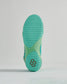 A close-up view of a vibrant green sneaker outsole featuring a textured grip pattern and modern design elements