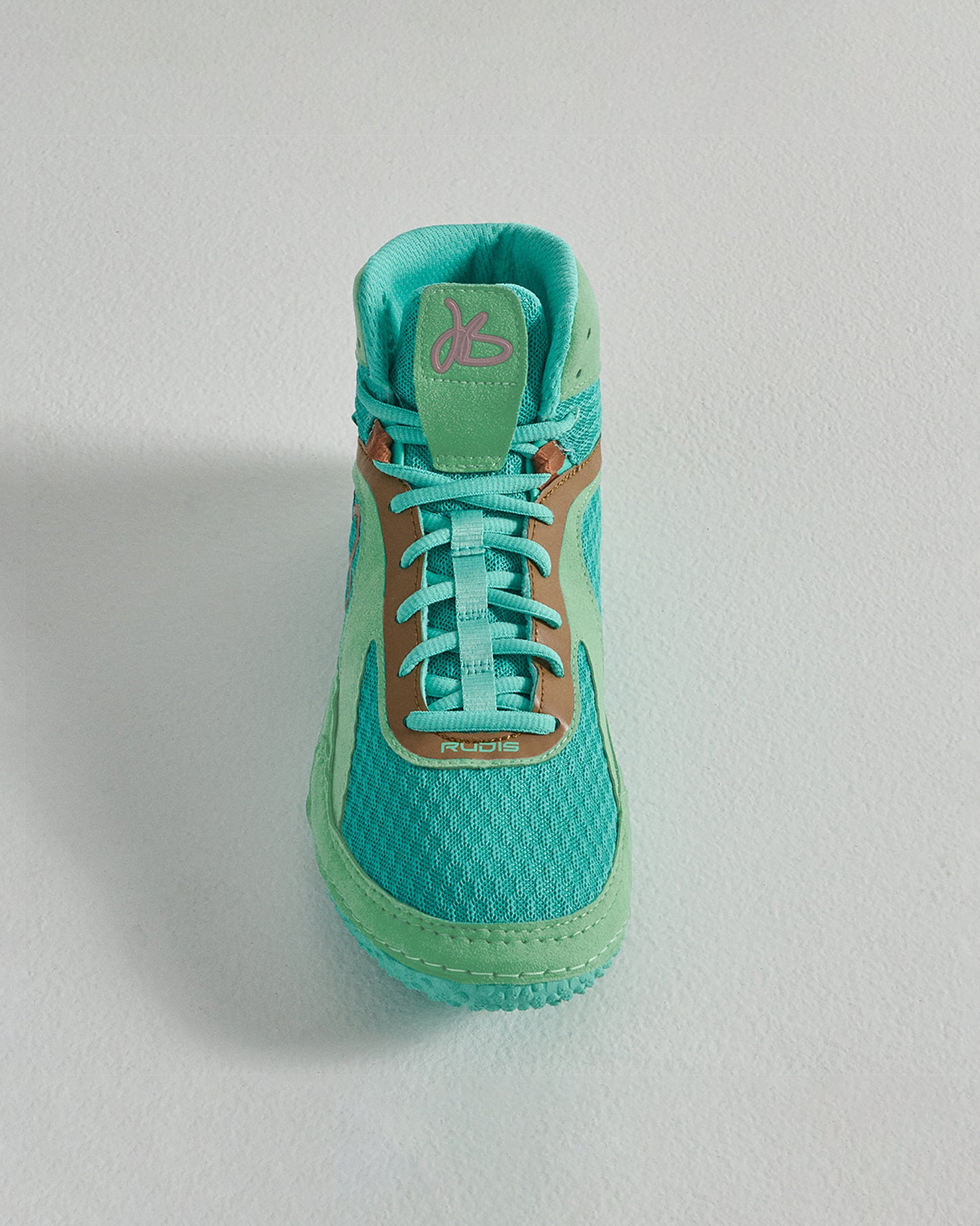 A vibrant turquoise athletic shoe with a breathable mesh upper featuring a sleek design and highlighted by a brown accent near the laces