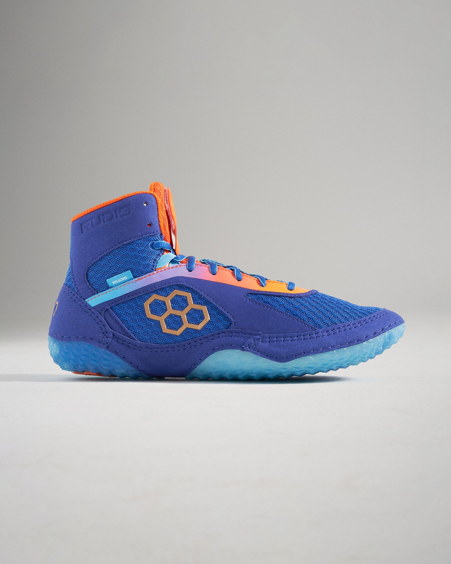 A side view of a vibrant blue and orange athletic shoe designed for performance featuring a sleek upper and a textured sole for grip