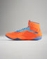 A vibrant orange and blue high-top athletic shoe designed for performance featuring a breathable mesh upper and durable rubber sole