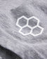 A close-up view of a light gray fabric featuring a white hexagonal logo highlighting the texture and detail of the material