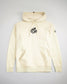 A cream-colored hoodie featuring the phrase a way of life printed in bold black text on the front and a logo on the sleeve