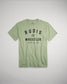 A light green t-shirt featuring bold black text that reads RUDIS WRESTLER A WAY OF LIFE