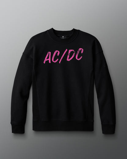 Black sweatshirt with pink 'AC/DC' logo on a gray background