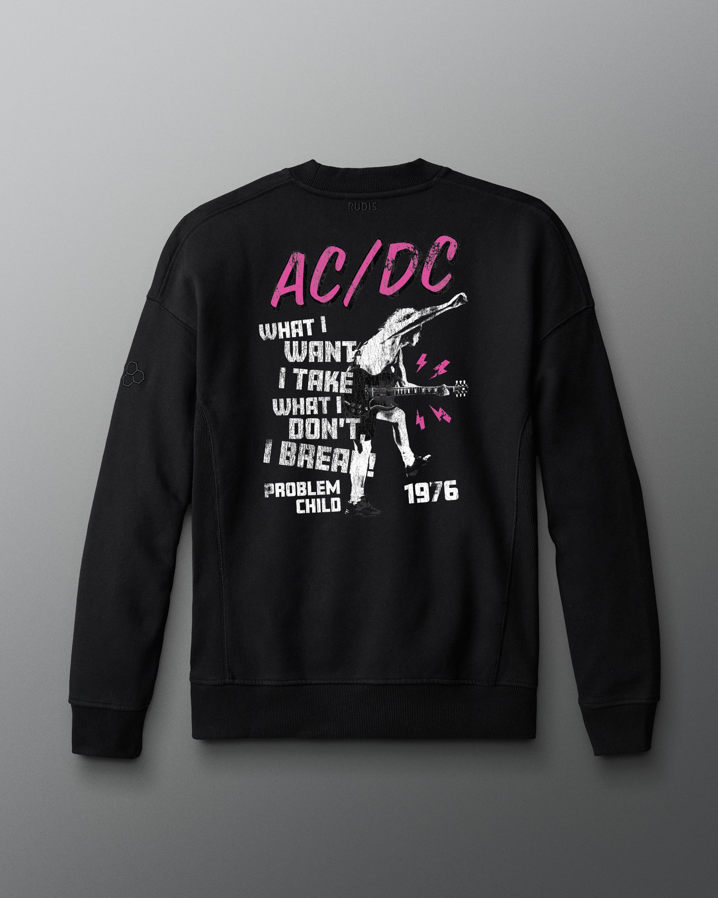 Black sweatshirt with AC/DC graphic design on a gray background