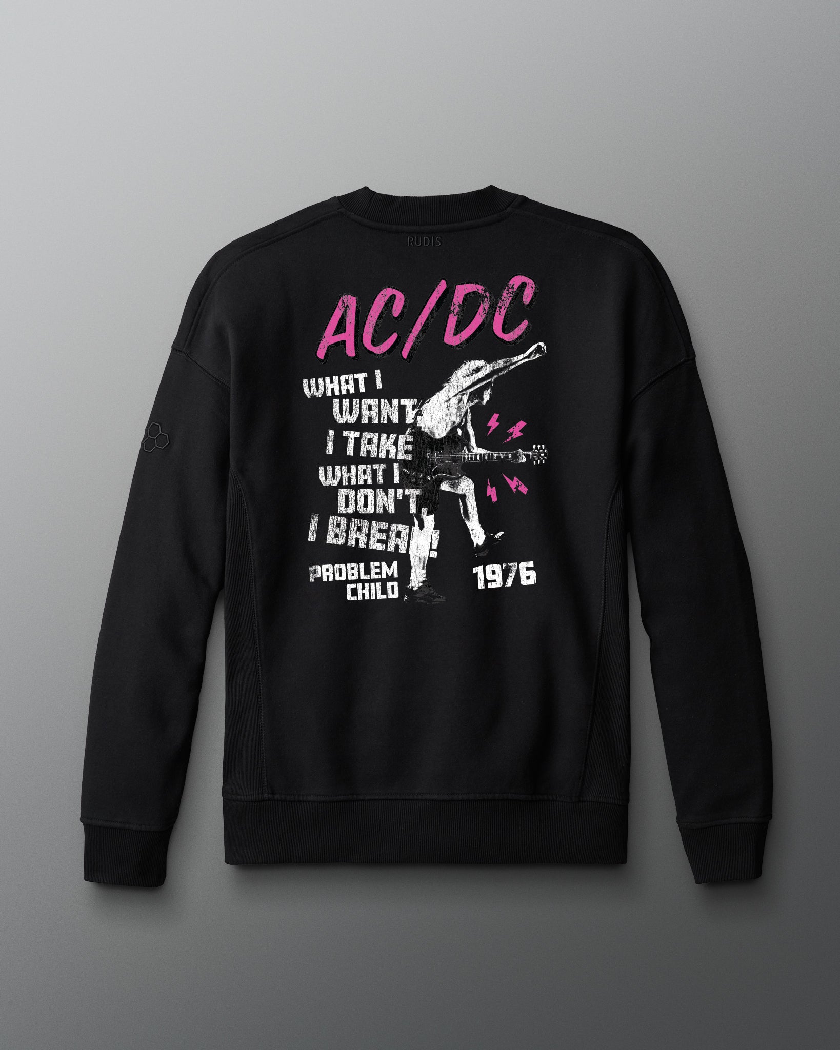 Black sweatshirt with AC/DC graphic design on a gray background