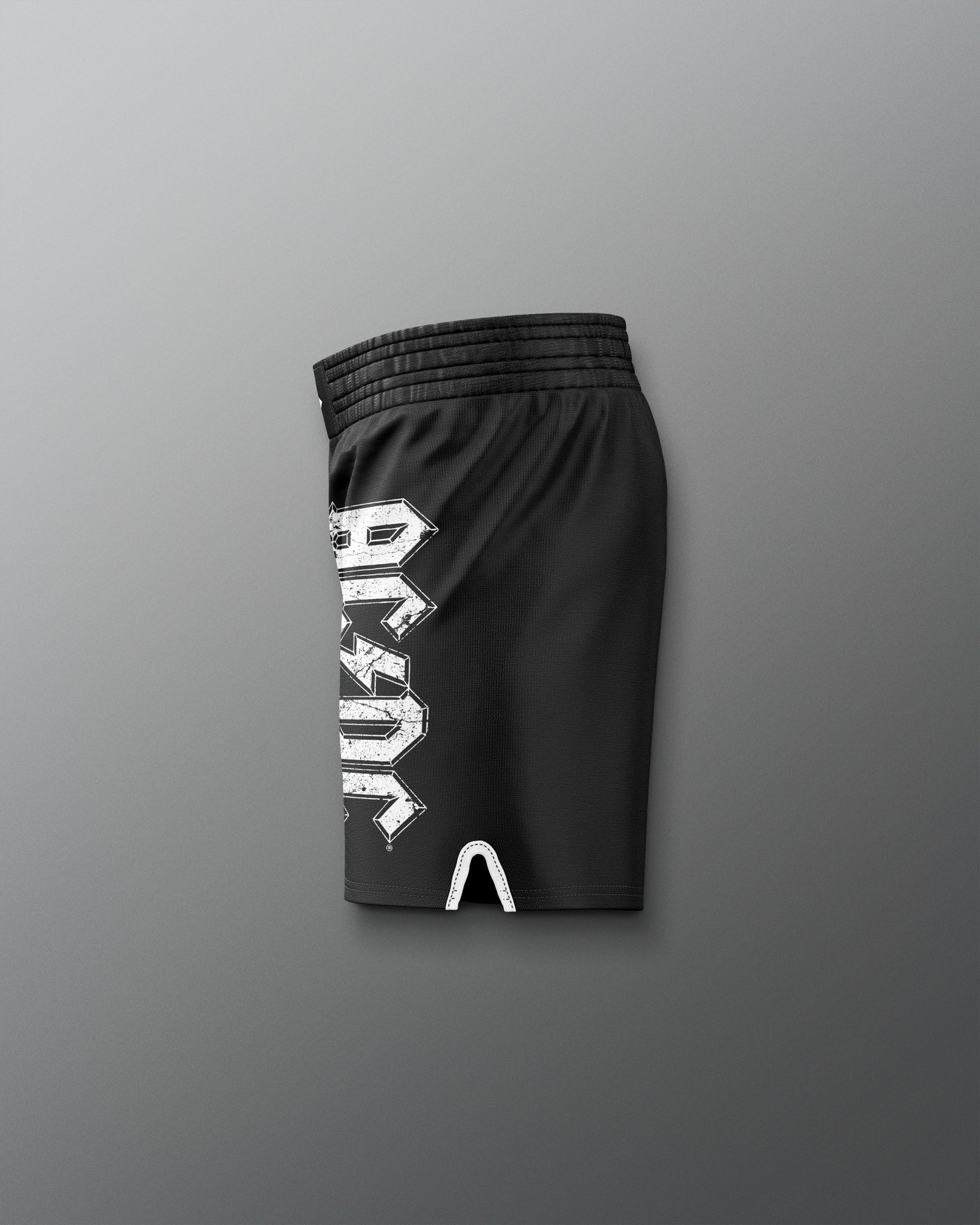 Black shorts with a white logo on a gray background