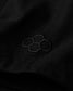 Black fabric with an embroidered hexagonal pattern