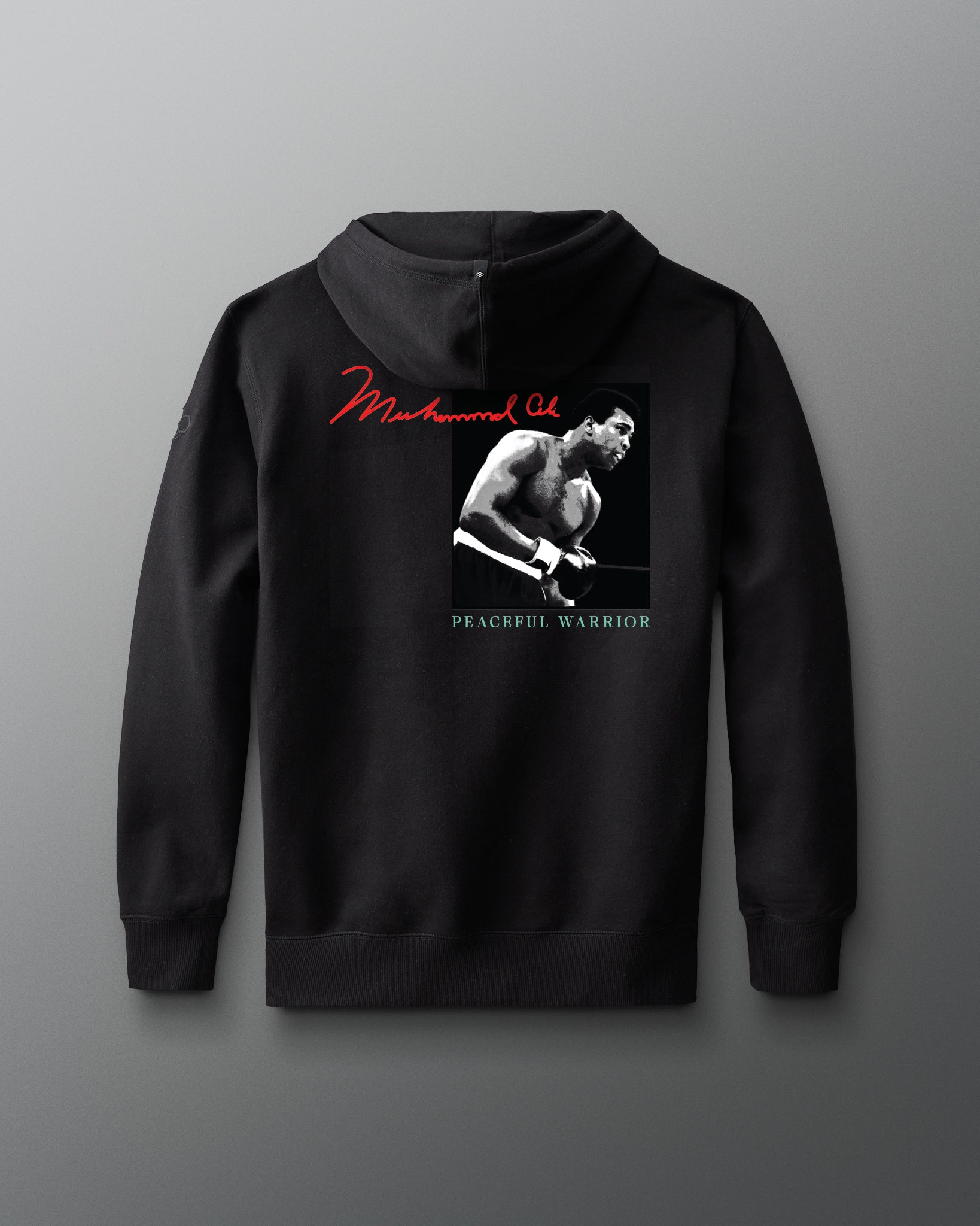 Black hoodie with a graphic of muhammad ali and text on a gray background