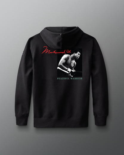 Black hoodie with a graphic of muhammad ali and text on a gray background