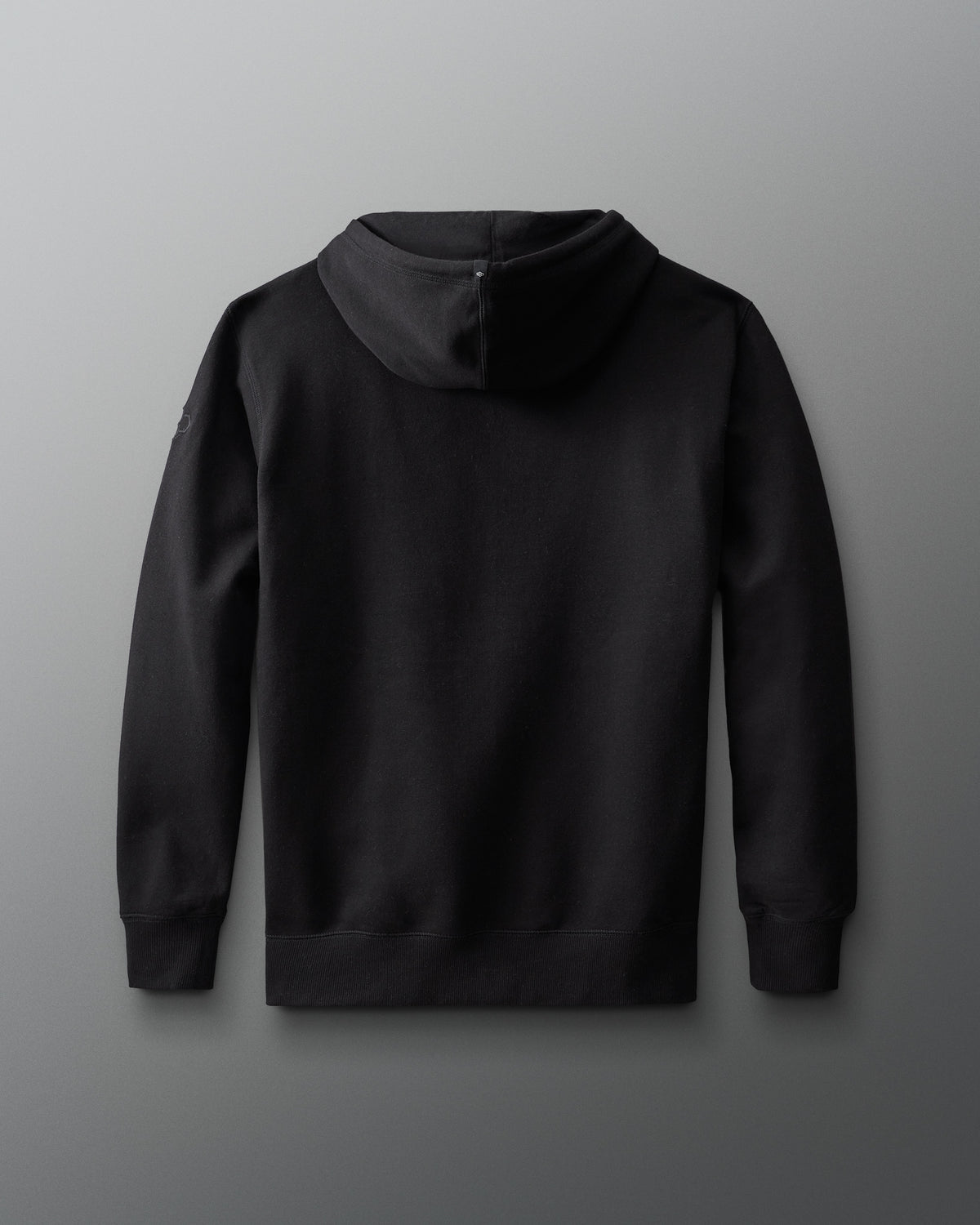 Back view of the black RUDIS Muhammad Ali Icon Comfort Fleece Hoodie with a clean, minimal design and pullover hood.