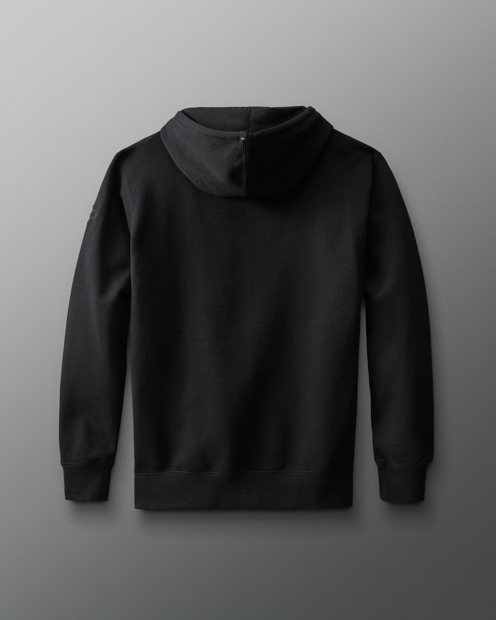 Back view of the black RUDIS Muhammad Ali Icon Comfort Fleece Hoodie with a clean, minimal design and pullover hood.