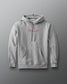 RUDIS Ali The Greatest Comfort Fleece Hoodie in gray, featuring Muhammad Ali’s signature in red across the chest, a kangaroo pocket, drawstring hood, and subtle RUDIS Hex sleeve branding.